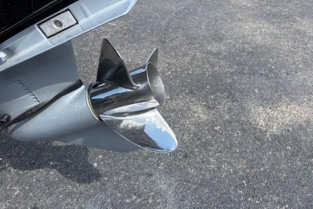 Slide: The Image of 2026 Tracker Pro Team 195 boat propeller on asphalt surface. - 5