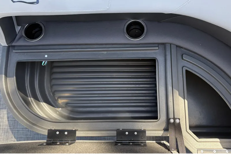 Slide: The Image of Storage compartment on 2026 Sun Tracker Party Barge 16 DLX with cup holders. - 22