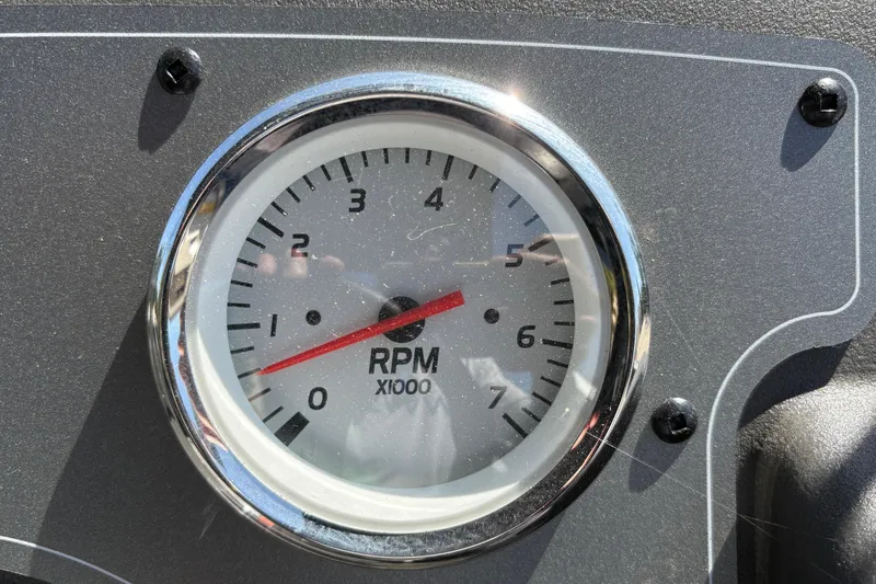 Slide: The Image of Close-up of RPM gauge on 2026 Sun Tracker Party Barge 16 DLX dashboard. - 20