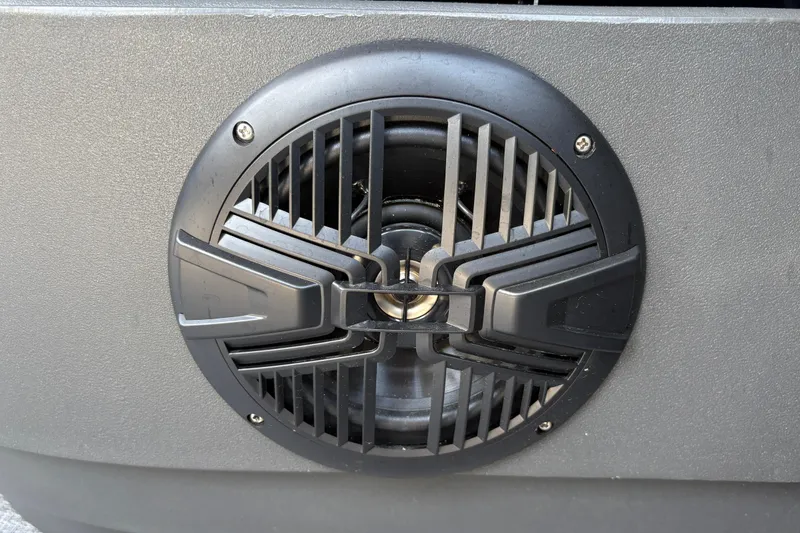 Slide: The Image of Close-up of a speaker on a 2026 Sun Tracker Party Barge 16 DLX. - 25