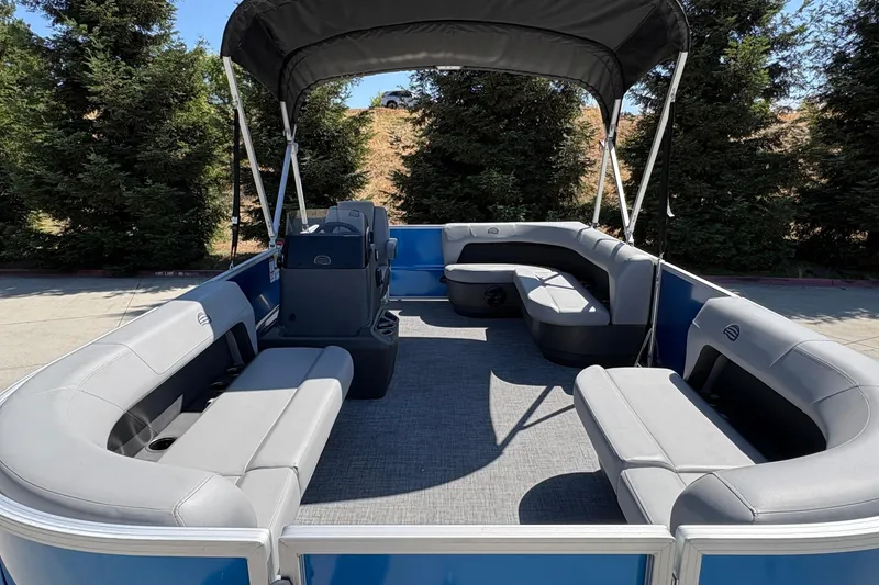 Slide: The Image of 2026 Sun Tracker Party Barge 16 DLX pontoon boat with spacious seating and canopy. - 14