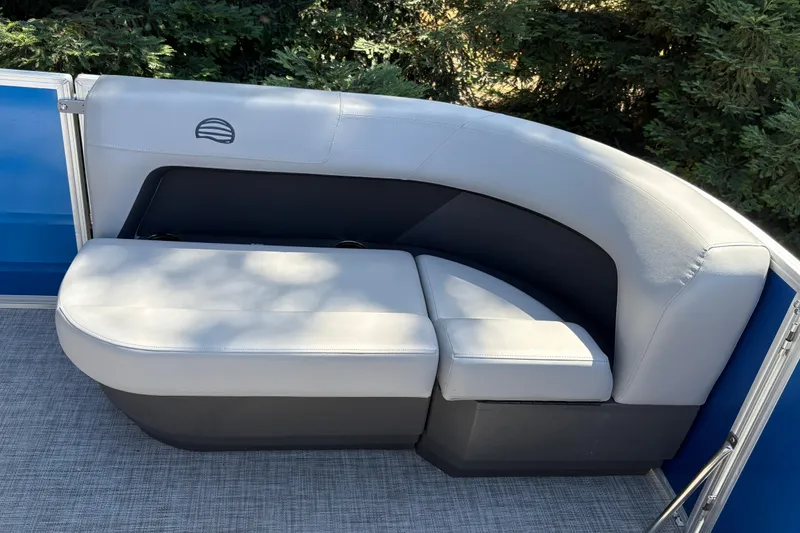 Slide: The Image of 2026 Sun Tracker Party Barge 16 DLX pontoon boat seating, featuring plush gray upholstery. - 15