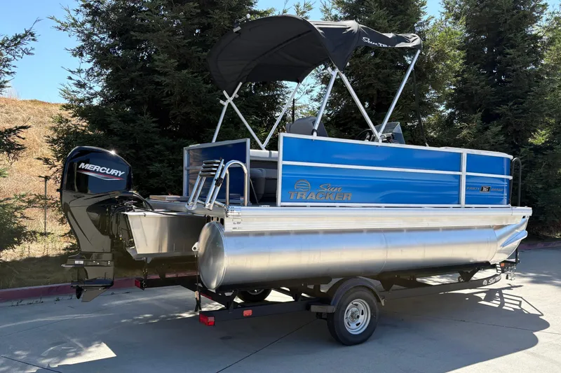 Slide: The Image of 2026 Sun Tracker Party Barge 16 DLX pontoon boat with Mercury engine on trailer. - 8