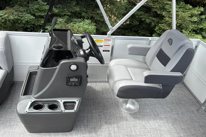 Slide: The Image of Captain's chair and console of 2026 Sun Tracker Party Barge 16 DLX pontoon boat. - 15