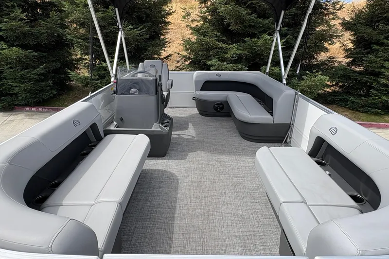 Slide: The Image of 2026 Sun Tracker Party Barge 16 DLX interior with spacious seating and modern design. - 14