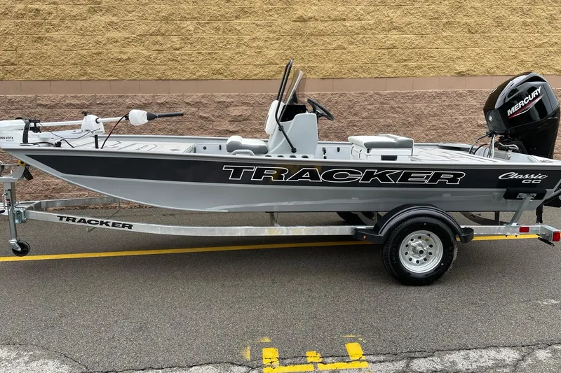 The Image of 2026 Tracker Bass Tracker Classic CC boat on trailer, side view. - 0