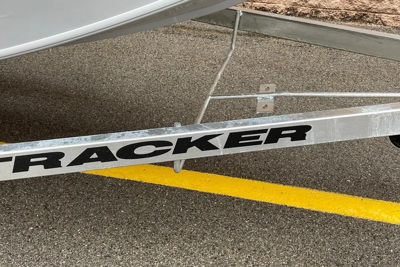 Slide: The Image of Trailer for 2026 Tracker Bass Tracker Classic CC boat on asphalt. - 2