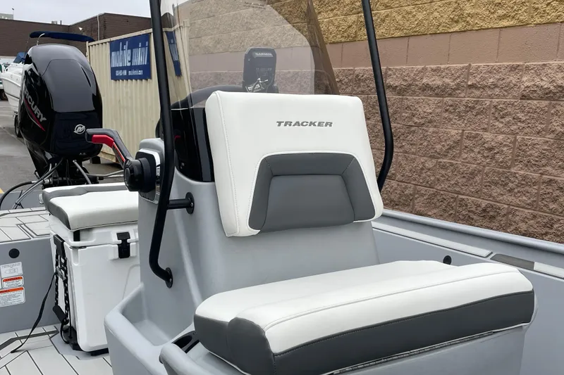 Slide: The Image of 2026 Tracker Bass Tracker Classic CC boat interior with seating and controls. - 7