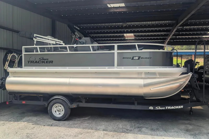 The Image of 2026 Sun Tracker Bass Buggy 16 XL Select pontoon boat in storage. - 0