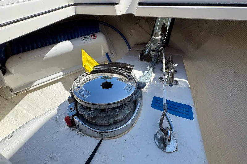 Slide: The Image of 2023 Cobia 280 Center Console anchor system with winch and chain detail. - 23
