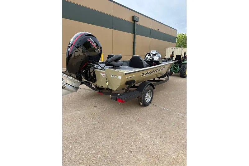 Slide: The Image of 2026 Tracker Pro Team 195 boat with powerful outboard motor on trailer. - 5