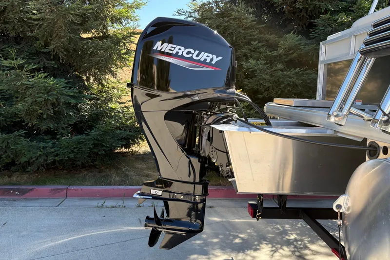 Slide: The Image of 2026 Sun Tracker Bass Buggy 16 XL Select with Mercury outboard motor. - 2