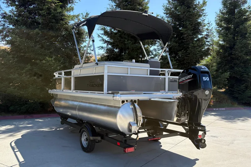 Slide: The Image of 2026 Sun Tracker Bass Buggy 16 XL Select pontoon boat with Mercury 50 engine. - 3