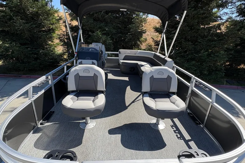 Slide: The Image of 2026 Sun Tracker Bass Buggy 16 XL Select pontoon boat interior with seating and canopy. - 8