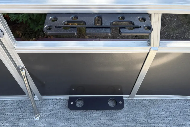 Slide: The Image of 2026 Sun Tracker Bass Buggy 16 XL Select boat railing with mounted accessory holder. - 21