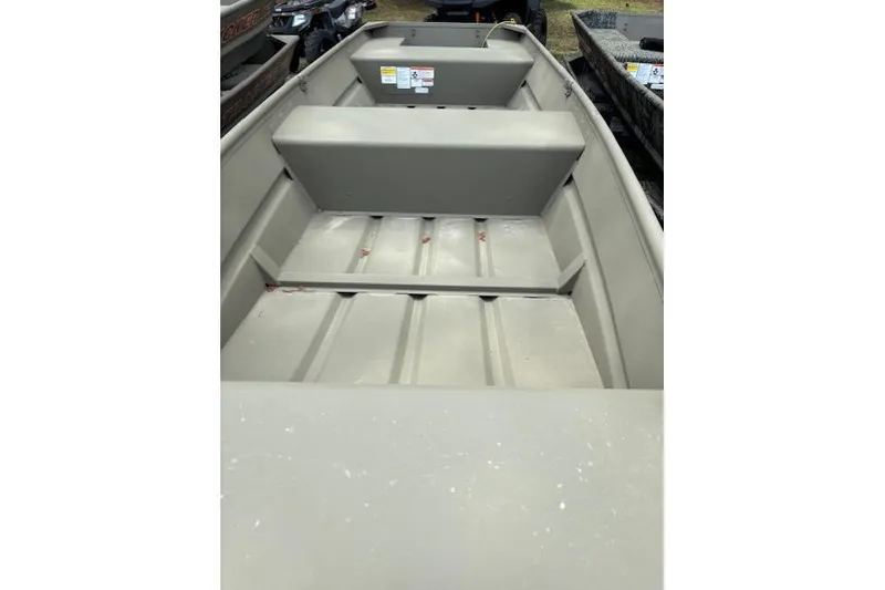 Slide: The Image of 2026 Tracker Grizzly 14 Jon boat interior, showcasing spacious seating and durable construction. - 2
