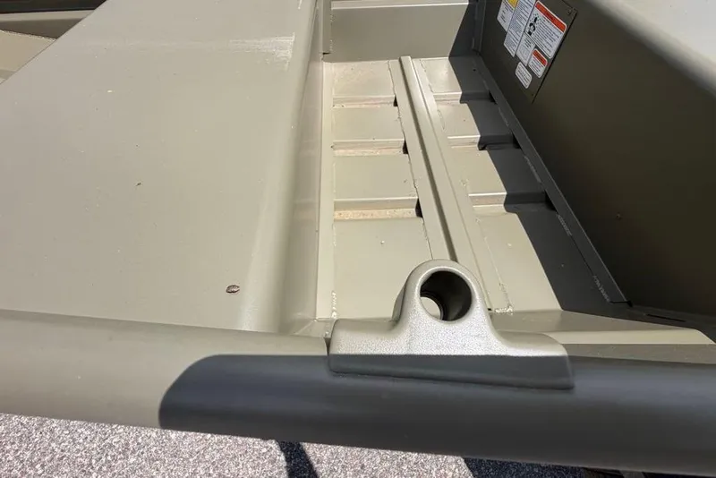 Slide: The Image of 2026 Tracker Grizzly 10 Jon boat interior, showcasing durable construction and storage features. - 31