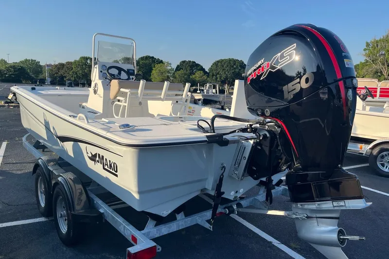 Slide: The Image of 2026 Mako Pro Skiff 19 CC boat with Mercury 150 engine on trailer. - 8