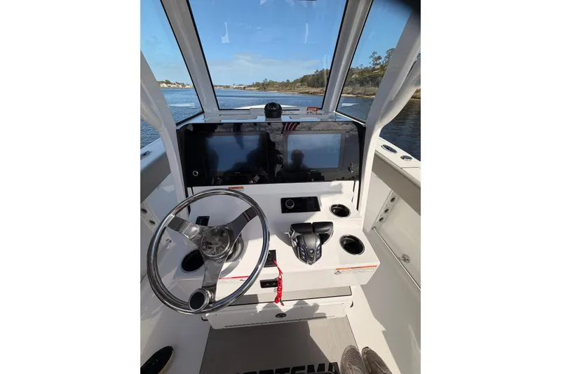 Slide: The Image of 2025 Sportsman Open 262 Center Console boat interior with seating and storage compartments. - 12