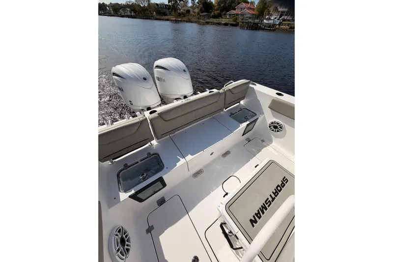 Slide: The Image of 2025 Sportsman Open 262 Center Console boat interior with sleek design and waterfront view. - 15