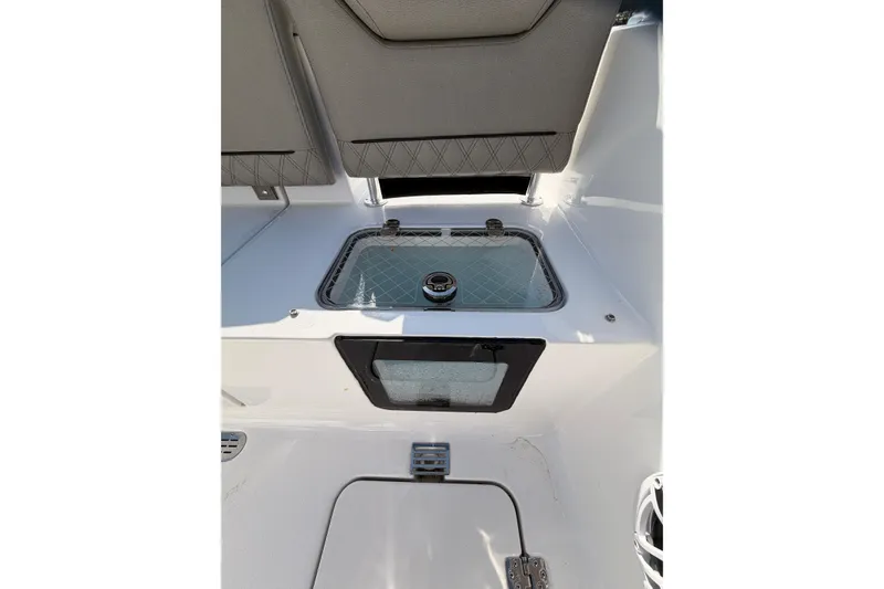 Slide: The Image of 2025 Sportsman Open 262 Center Console boat with dual outboard engines on water. - 18