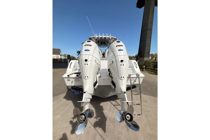 Slide: The Image of 2025 Sportsman Open 262 Center Console with dual 200 horsepower engines, rear view. - 7