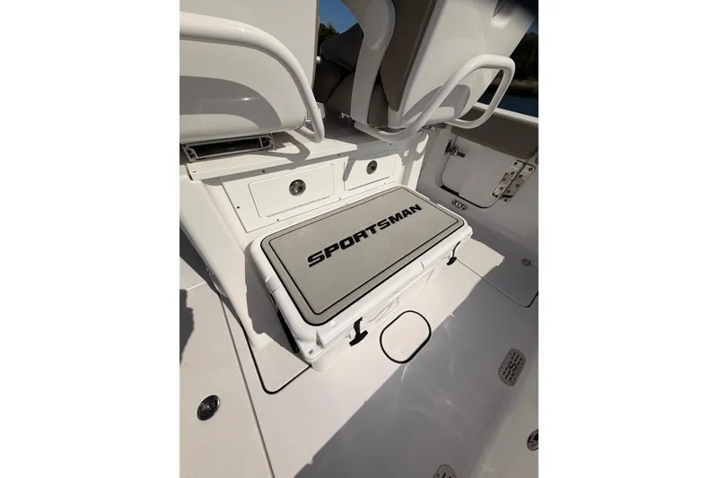 Slide: The Image of 2025 Sportsman Open 262 Center Console boat interior with storage and seating. - 19