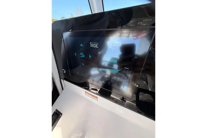 Slide: The Image of 2025 Sportsman Open 262 Center Console touchscreen display with navigation controls. - 22