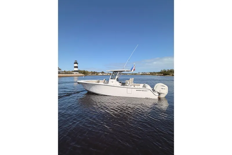 Slide: The Image of 2025 Sportsman Open 262 Center Console boat on water near lighthouse. - 4