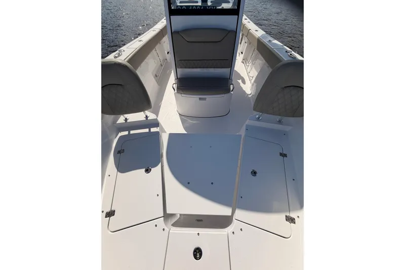 Slide: The Image of 2025 Sportsman Open 262 Center Console boat interior with seating and storage compartments. - 8
