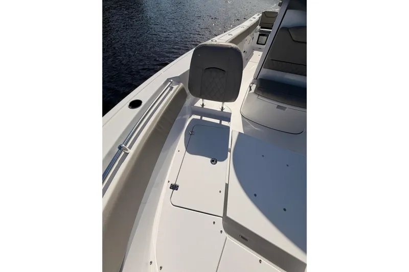 Slide: The Image of 2025 Sportsman Open 262 Center Console boat interior with seating and storage compartments. - 9
