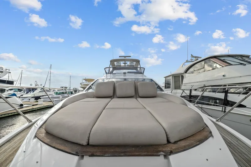 Slide: The Image of Luxurious 2019 Azimut 55 yacht with spacious sunbed, docked at marina under blue sky. - 12