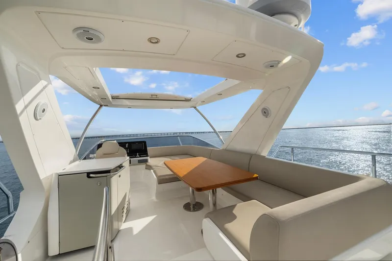 Slide: The Image of Luxurious 2019 Azimut 55 yacht deck with seating and ocean view. - 14