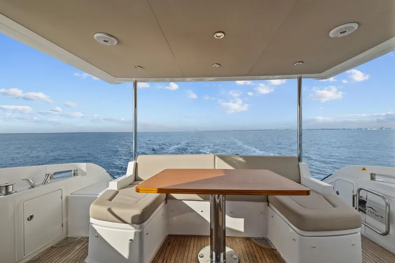 Slide: The Image of Azimut 55 yacht deck with seating and ocean view, 2019 model. - 19