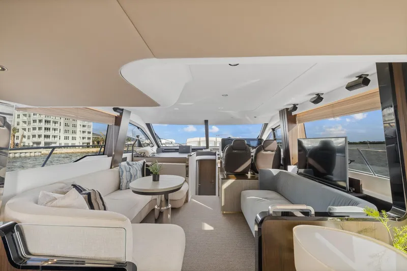 Slide: The Image of Luxurious interior of 2019 Azimut 55 yacht with modern furnishings and panoramic windows. - 20
