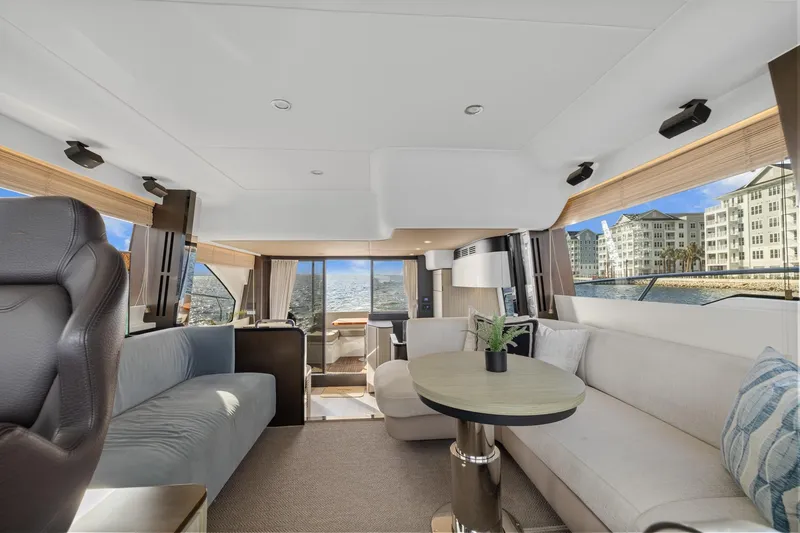 Slide: The Image of Luxurious interior of 2019 Azimut 55 yacht with modern seating and panoramic windows. - 21