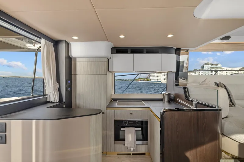 Slide: The Image of Luxurious interior of 2019 Azimut 55 yacht with modern kitchen and scenic ocean view. - 22
