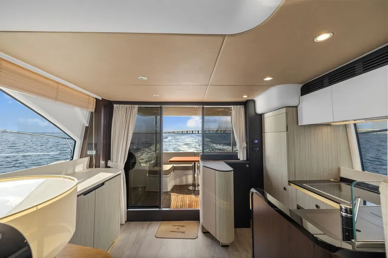 Slide: The Image of Luxurious interior of 2019 Azimut 55 yacht with ocean view through large windows. - 23