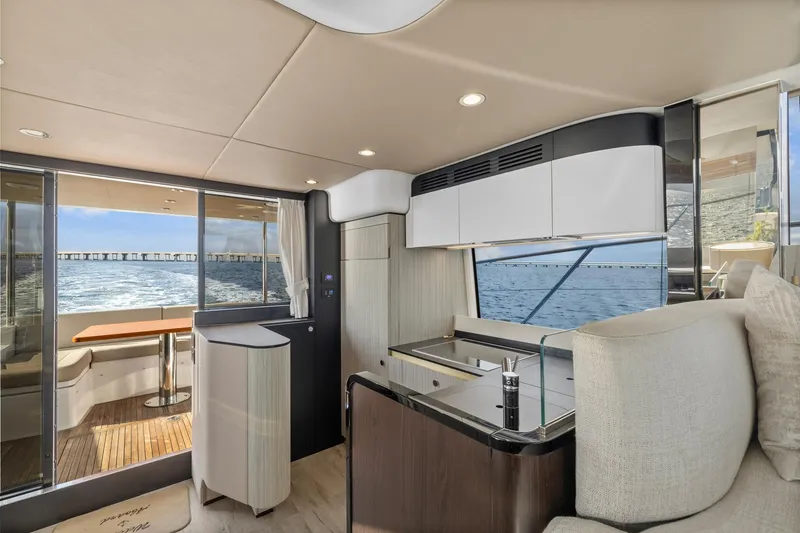 Slide: The Image of Luxurious interior of 2019 Azimut 55 yacht with modern kitchen and ocean view. - 25