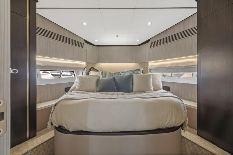 Slide: The Image of Luxurious bedroom interior of 2019 Azimut 55 yacht with modern design and cozy bedding. - 28