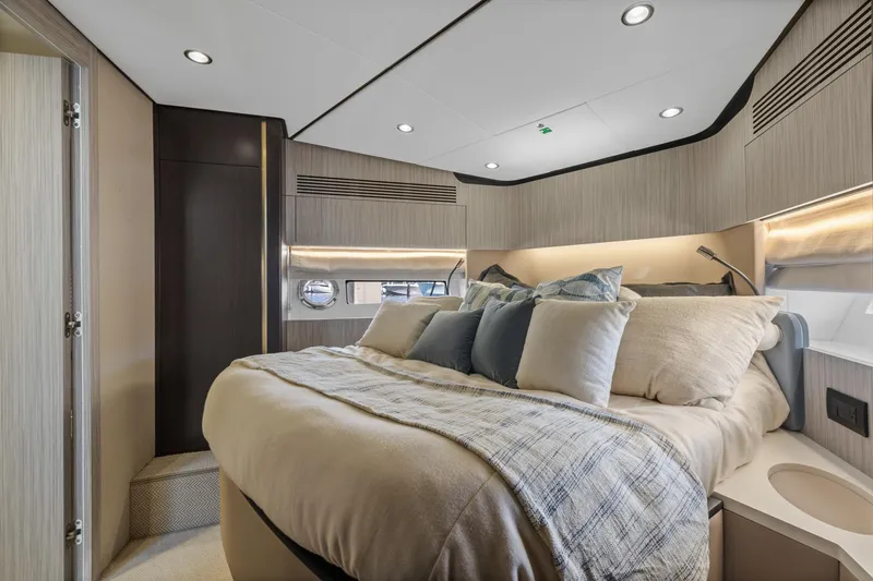 Slide: The Image of Luxurious bedroom interior of 2019 Azimut 55 yacht with modern design and cozy bedding. - 29