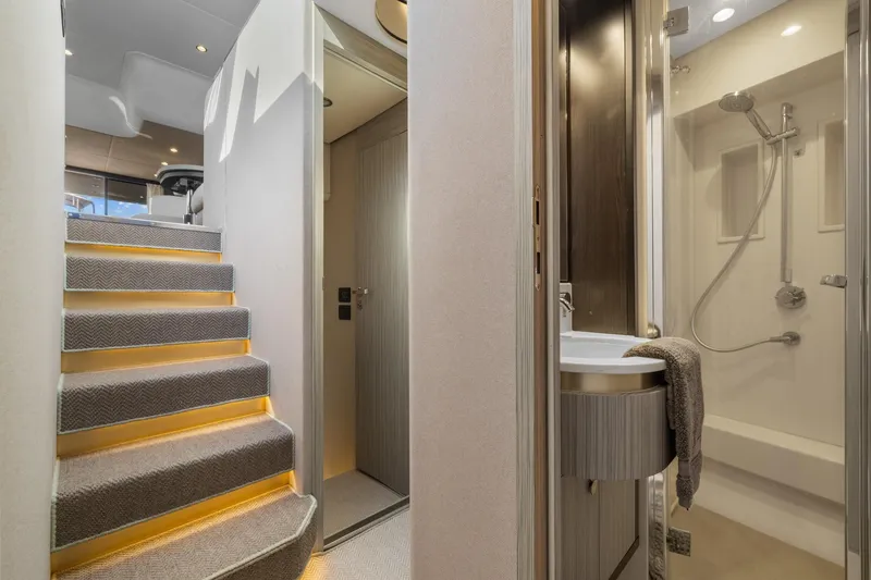 Slide: The Image of Luxurious interior of 2019 Azimut 55 yacht featuring staircase and modern bathroom. - 33