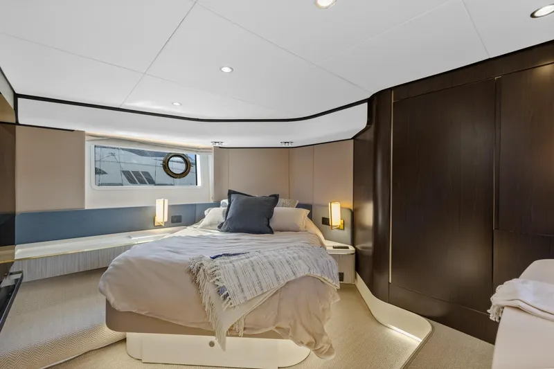 Slide: The Image of Luxurious bedroom interior of 2019 Azimut 55 yacht with modern design and cozy bedding. - 34
