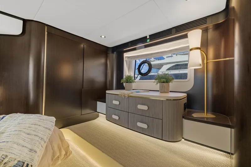 Slide: The Image of Luxurious interior of 2019 Azimut 55 yacht with elegant wood finishes and modern decor. - 35