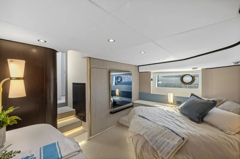 Slide: The Image of Luxurious interior of 2019 Azimut 55 yacht, featuring elegant bedroom design and modern lighting. - 36