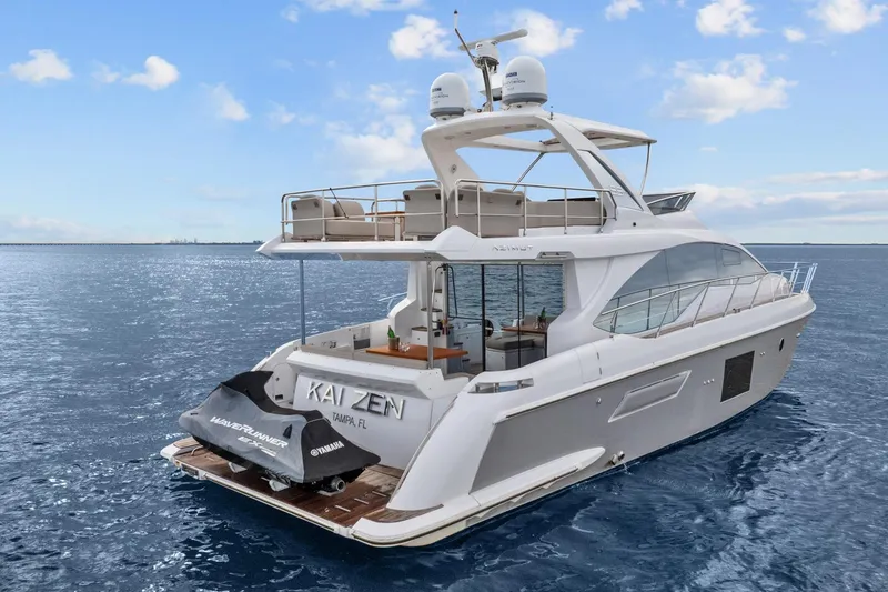 Slide: The Image of Luxury 2019 Azimut 55 yacht on open water, featuring sleek design and spacious deck. - 8