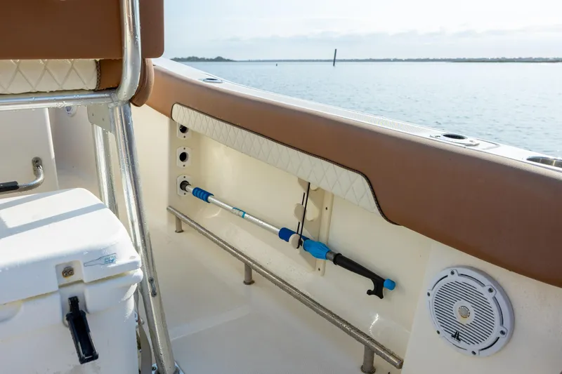 Slide: The Image of Interior view of 2022 Pioneer 202 Islander boat with rod holder and speaker. - 18