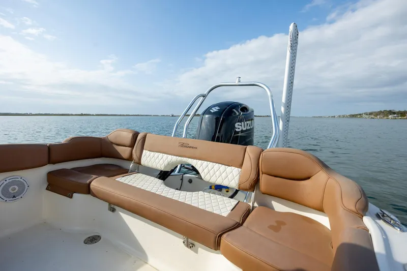 Slide: The Image of 2022 Pioneer 202 Islander boat with Suzuki engine on calm water. - 19