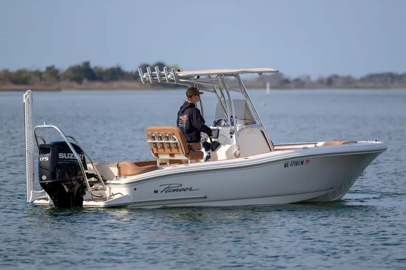 Slide: The Image of 2022 Pioneer 202 Islander boat on calm water with Suzuki outboard motor. - 3