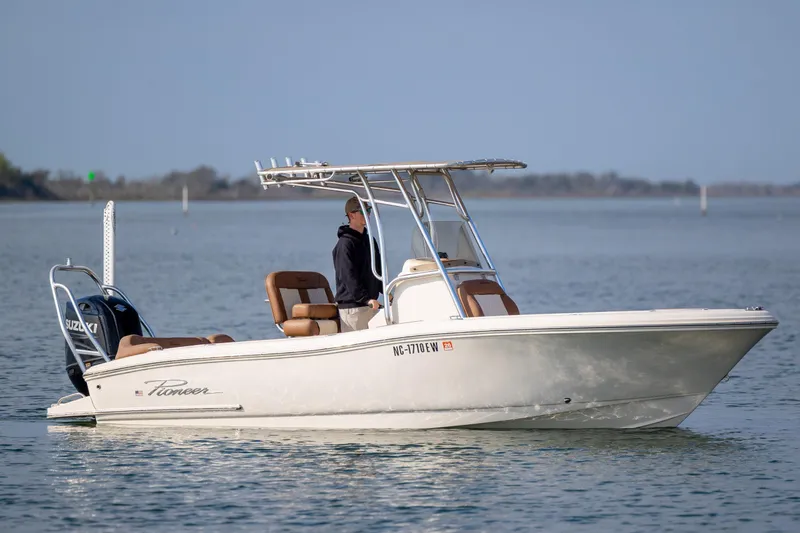 Slide: The Image of 2022 Pioneer 202 Islander boat on calm water with Suzuki outboard motor. - 5